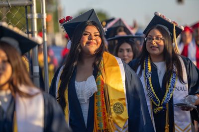 An NAU-Yuma student stands in line at commencement.