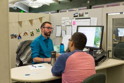 Student talking to an advisor.