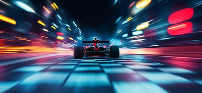 Formula 1 car with blocks of light and color (red, blue and yellow) around it