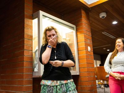 Kathleen King covers her mouth