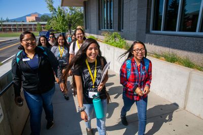 A group of students take a tour of the NAU Flagstaff campus.