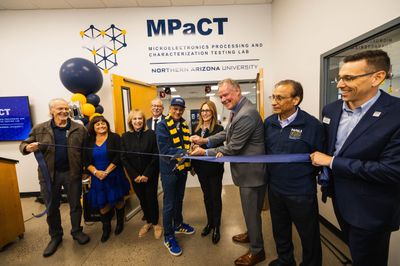 Dignitaries cut the ribbon at the MPaCT Lab.